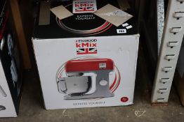 A boxed Kenwood K Mix KMX750RD food processor in red.