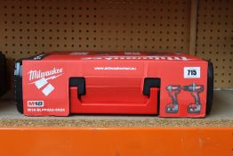 An as new Milwaukee M18 BLPP2A2-502X 18V Combi Drill/Impact Driver Twin Kit (Includes two