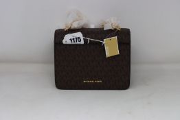 An as new Michael Kors Jade XS Gusset crossbody bag.