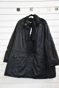 An as new Ulla Popken raincoat (EU 58/60 - RRP €150).