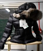 An as new Moncler coat (Size 2).