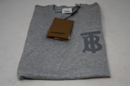 An as new Burberry Emerson monogramed top in grey (M - RRP £350 - Please note item has security