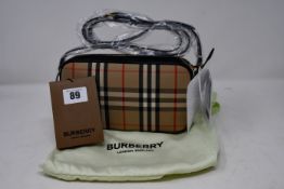 An as new Burberry vintage check camera bag with dust bag (RRP $830).
