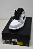 A pair of as new Nike Air Jordan 1 Low in smoke grey (UK 9).