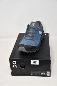A pair of as new On Running Cloudventure trainers (UK 7).