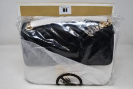 An as new Michael Kors Peyton medium quilted leather shoulder bag.