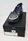 A pair of as new Hugo Boss Titanium Runn trainers (UK 11).