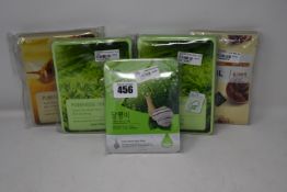 Two packs of 10pcs Tony & Moly pureness green 100 mask sheets, one pack of 10pcs Esfolio snail