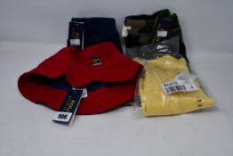 Four items of children's Ralph Lauren clothing/accessories; navy skirt (8-10 years), polo shirt (3