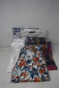 Five items of as new Desigual clothing; a pair of jeans (UK 20) and four shirts (1 x UK 14, 3 x