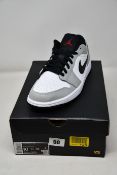 A pair of as new Nike Air Jordan 1 Low in smoke grey (UK 9).