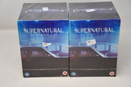 Two as new Supernatural seasons 1-13 DVD box sets.