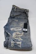 A pair of as new Represent Shredded jeans in blue cream (32