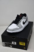 A pair of as new Nike Air Jordan 1 Low in smoke grey (UK 8.5).