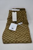 A pair of as new Gucci GG print drawstring trousers (Size 48 - RRP £680).