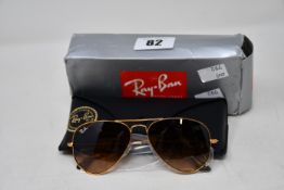 A pair of as new Ray Ban sunglasses.