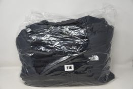 A women's as new The North Face stretch down parka coat (M).