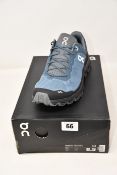A pair of as new On Running Cloudventure trainers (UK 8).