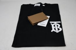 An as new Burberry Atherton long sleeved monogramed top in black (L - RRP £370 - Please note item
