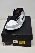 A pair of as new Nike Air Jordan 1 Low in smoke grey (UK 8).