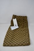 A pair of as new Gucci GG print drawstring trousers (Size 50 - RRP £680).