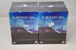 Two as new Supernatural seasons 1-13 DVD box sets.