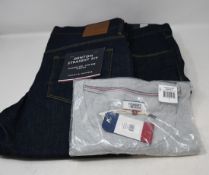 Two pairs of as new Tommy Hilfiger jeans (W32/L34) and a Tommy Jeans T-shirt (S).