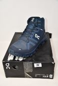 A pair of as new On Running Cloudrock Waterproof boots (UK 12).