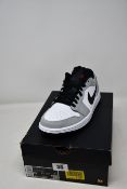 A pair of as new Nike Air Jordan 1 Low in smoke grey (UK 7.5).