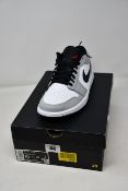 A pair of as new Nike Air Jordan 1 Low in smoke grey (UK 9).