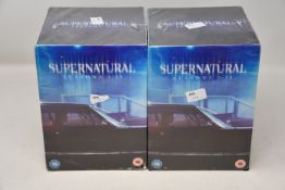 Two as new Supernatural seasons 1-13 DVD box sets.
