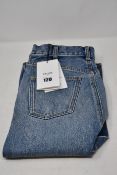 A pair of as new Celine Paris long low rise denim skirt (Size 24 - RRP £560).