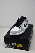 A pair of as new Nike Air Jordan 1 Low in smoke grey (UK 9).