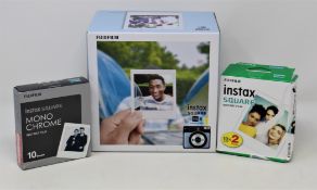 A boxed as new Fujifilm Instax Square SQ6 Instant Camera in Aqua Blue with a pack of Fujifilm Instax