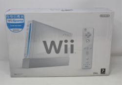 A boxed as new Nintendo Wii Console with Wii Sports Game (Box sealed, some damage to box).