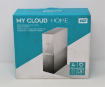 A boxed as new WD My Cloud Home 4 TB NAS Drive (serial number: WX32SA0F24E3, box sealed).
