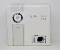 A boxed as new Olympus Pen E-PL8 Micro Four Thirds System Digital Camera and an M.Zuiko Digital 14-
