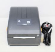 A boxed ZEBRA ZD220 Thermal Printer (M/N: ZD22042-D0EG00EZ) (Appears as new, some cosmetic damage to