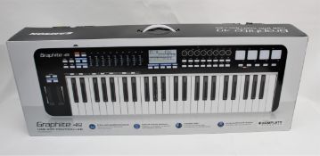 A boxed as new Samson Graphite 49 USB MIDI Keyboard Controller (M/N: SAKGR49) (Box opened).