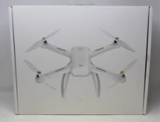 A boxed as new Xiaomi Mi Drone 4k Quadcopter Drone (Box sealed. Packaging text in Chinese. UK plug