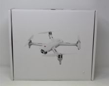 A boxed as new Xiaomi FIMI A3 Quadcopter Drone (M/N: FMWRJ01A3) (Box sealed. UK plug adaptor