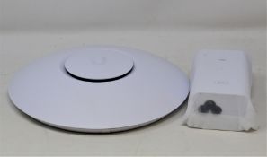 A boxed as new Ubiquiti Unifi AC Lite AP Wireless Access Point (UAP-AC-LITE EU) (UK plug adaptor
