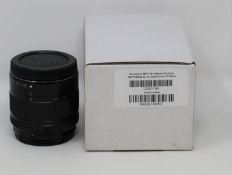 A boxed as new Panasonic Lumix G Vario 35-100mm f/4.0-5.6 Asph Mega O.I.S. Lens in Black (Box