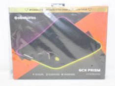 A boxed as new SteelSeries QcK Prism RGB Gaming Mouse Pad in Medium (Box sealed).