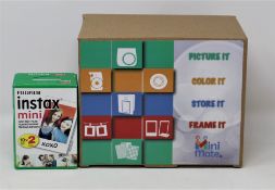 A boxed as new Fujifilm Instax Mini 9 Instant Camera in Smoky White, two twenty sheet packs of
