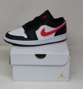 A pair of women's as new Nike Air Jordan 1 Low sneakers (UK 7).