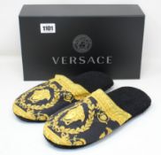 A pair of as new Versace slippers (Size unknown).