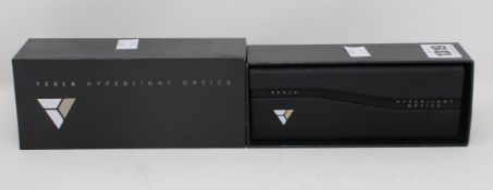 A pair of as new brown Tortoiseshell Tesla hyperlight optics glasses with case (Damage to outer