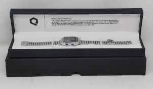 An as new Q Timex Reissue Digital LCA 32.5mm stainless steel bracelet watch in case.