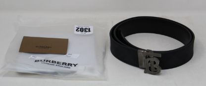 An as new Burberry reversible monogram London Check belt (Size 90 - RRP £370).